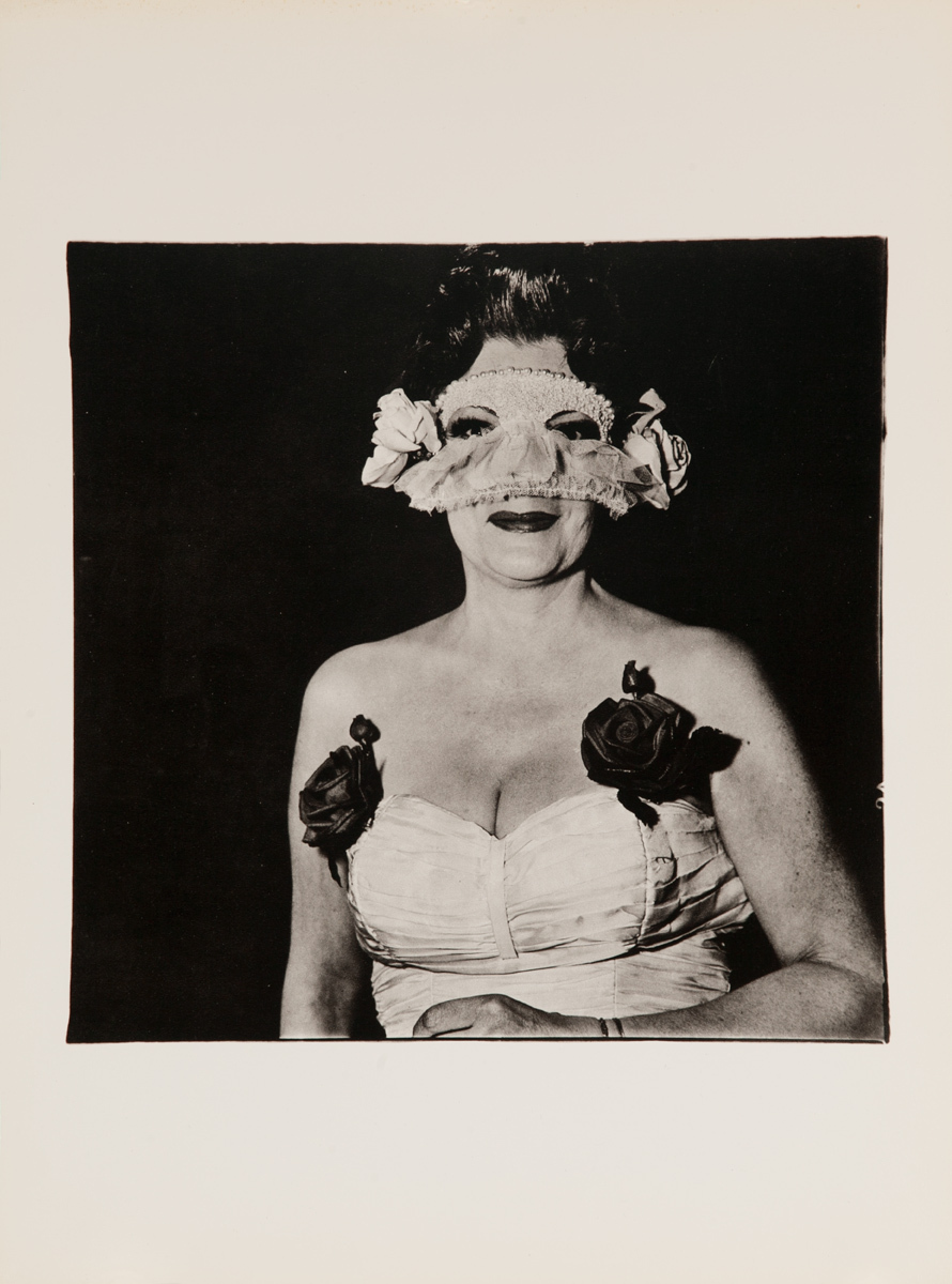 Lady at a masked ball with two roses on her dress, New York, 1967