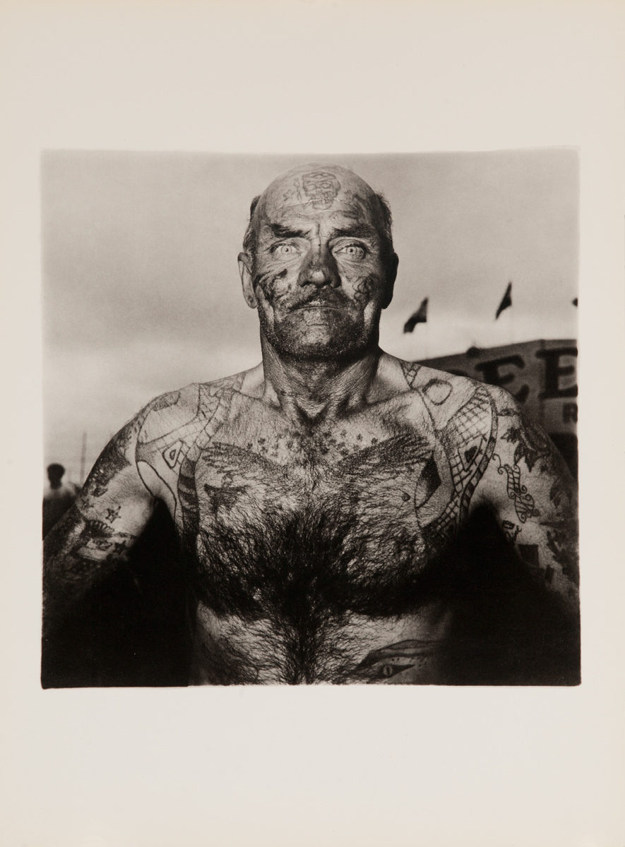 Tattooed man at a carnival, Maryland, 1970